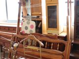 a lot of furniture in a room with a lot of windows