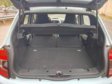 the back of a car with its trunk open on the side of the road
