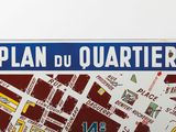 a sign that says plan du quarter on it