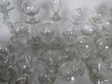 a lot of wine glasses sitting on a table