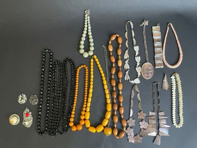 several different types of necklaces and bracelets on a table