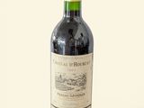 a bottle of wine that is sitting on a table