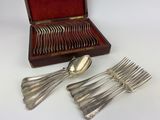 a set of silverware in a case with a spoon and fork