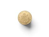 a close up of a gold coin on a white surface