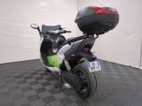 an image of a motor scooter parked in a garage