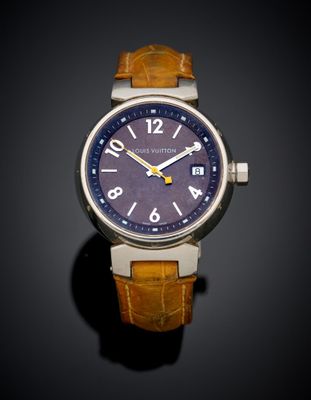 an image of a close up of a wrist watch on a black surface