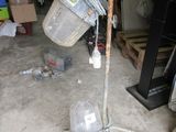 an image of a trash can and bucket in a garage