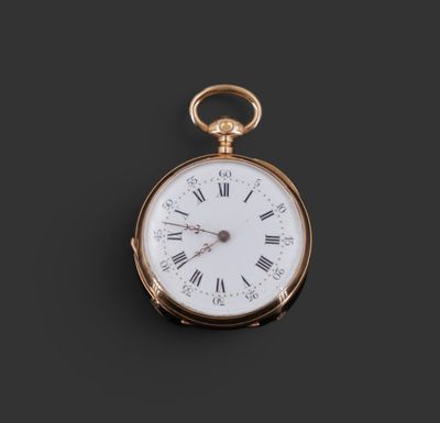a close up of a gold pocket watch with roman numerals and roman numerals