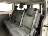 two seats in the back of a van that is empty