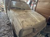 a dirty truck that is parked in a garage