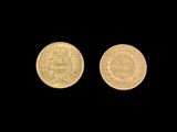 two gold coins on a black background with a black background
