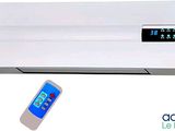 an image of a white air conditioner sitting next to a remote control