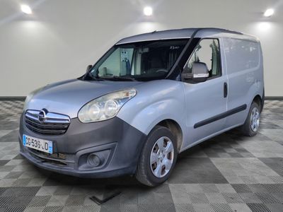 a picture of a silver van parked in a room