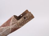 a wooden object with a hole in the middle of it