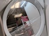 a white washer sitting inside of a white box