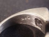 a close up of a metal ring with holes in it