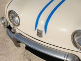 a white car with blue stripes parked on the side of the road