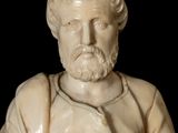 marble bust of a man with a beard and a white shirt