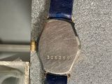 a close up of a watch on display on a table