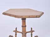 an image of a small table with a wooden top on a white background
