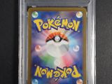 a close up of a pokemon card in a plastic case