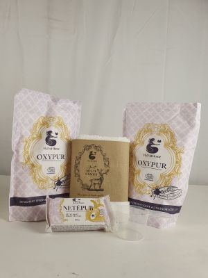 a couple of bags of soap sitting on top of a table