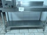 a stainless steel table with a microwave on it