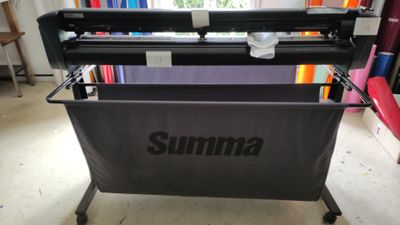 a large format printer sitting on top of a table in a room