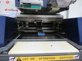 an image of a machine that is cutting a piece of paper