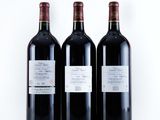 three bottles of wine sitting next to each other on a table