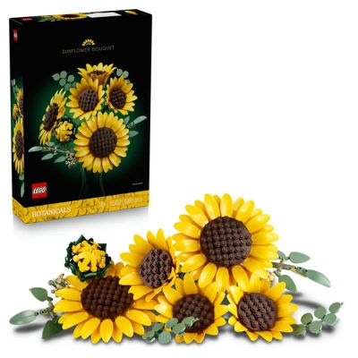 trois tournesols posés devant une boîte