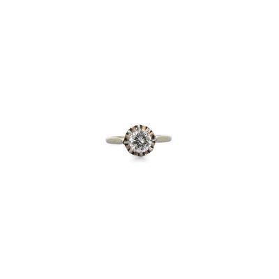 a close up of a diamond ring on a white background