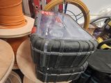 a black suitcase sitting on top of a wooden table