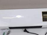 an image of a white air conditioner sitting on top of a table