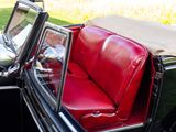 a black car with a red seat and a black car with a red seat