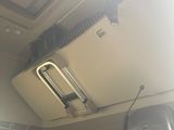 a view of the inside of a vehicle with a tv mounted to the ceiling