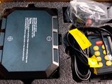 a box with a remote control and other items in it