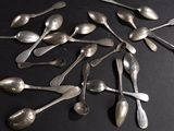 a lot of spoons that are sitting on a table
