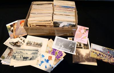 many old photos in a wooden box on a black table