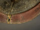 a close up of a leather hat with a metal buckle