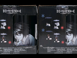 they are two boxes of anime figurines of a man and a woman