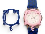 a watch with a cat face on it next to a blue watch band