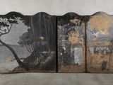 three panels with a painting of trees on them in front of a white wall