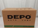 une boîte de lampes Depo Auto posée sur une table