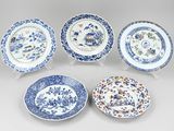 six blue and white plates with floral designs on them
