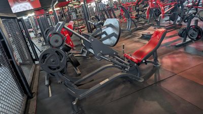 a large gym with a lot of machines in it