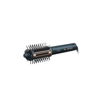 un gros plan d'une brosse à cheveux munie de picots