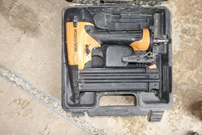 a tool box with a stapler and a stapler in it