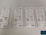 four nintendo wii remotes are sitting on a white table