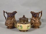 three different types of vases sitting on a table